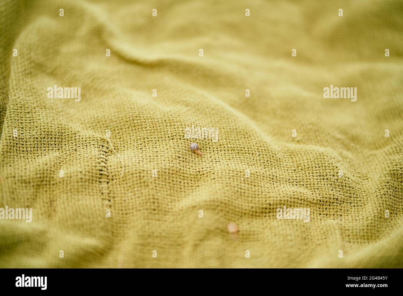 Green woven burlap blanket close-up Stock Photo