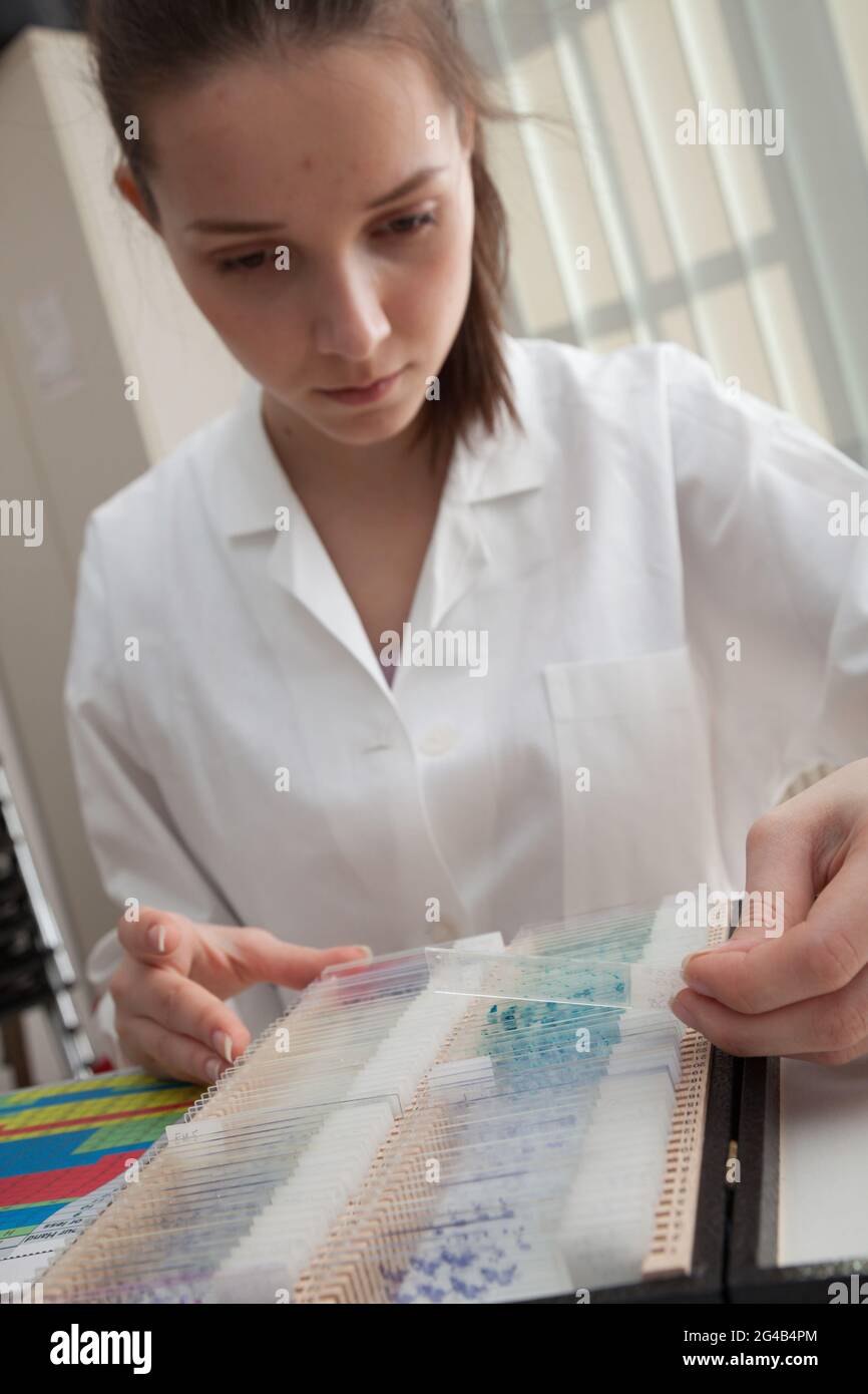 Girl laboratory Assistant works with an antiviral drug in a