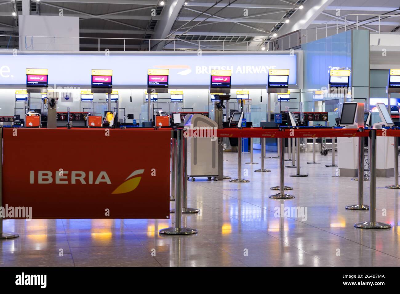 Check-in desk for IBERIA, IAG group, British airways at London Heahrow airport terminal, ENgland, UK Stock Photo