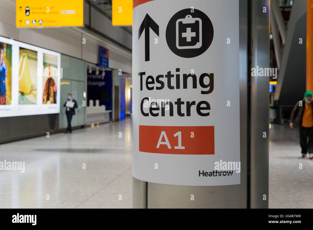 sign posted to COVID-19 testing centre at London Heathrow terminal for travellers , London, England Stock Photo
