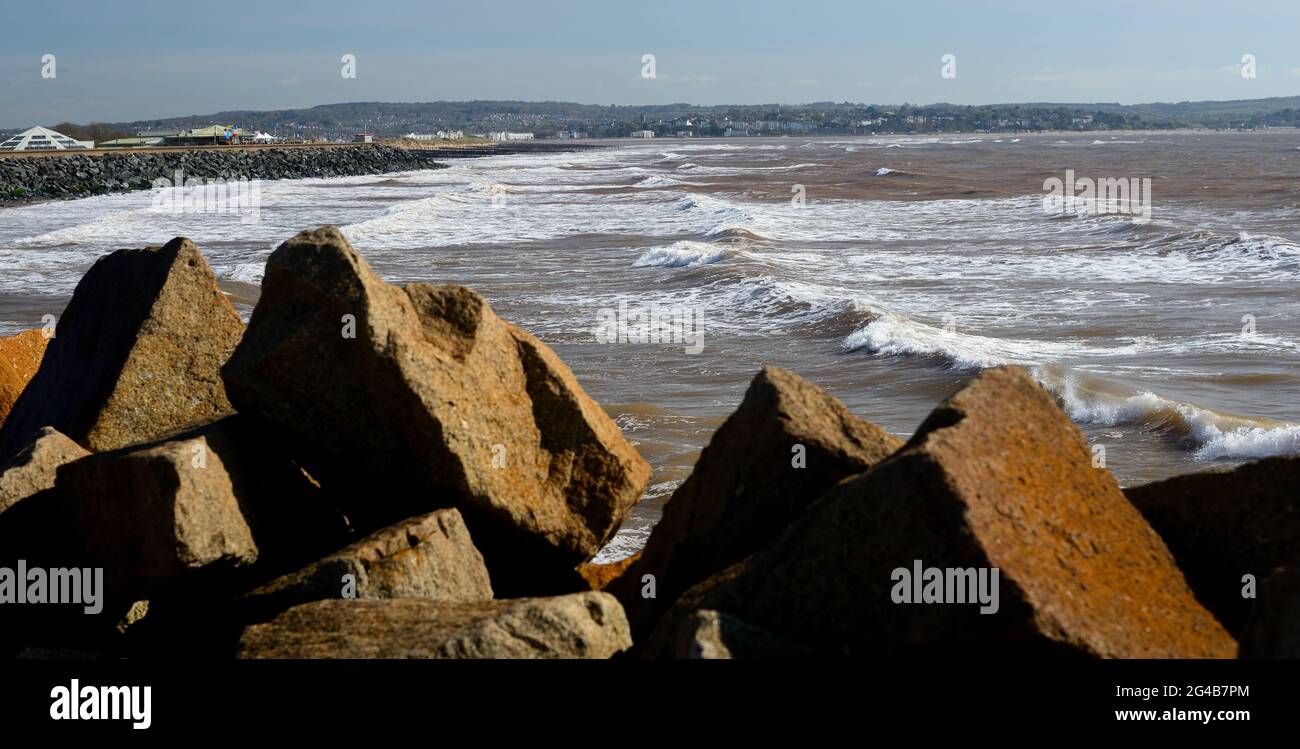 Rock armour and tide at Dawlish Warren, South Devon Stock