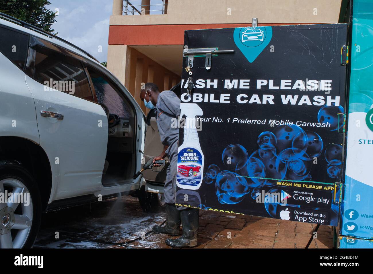 June 18, 2021, Nairobi, Kiambu County, Kenya A staff member of Wash Me