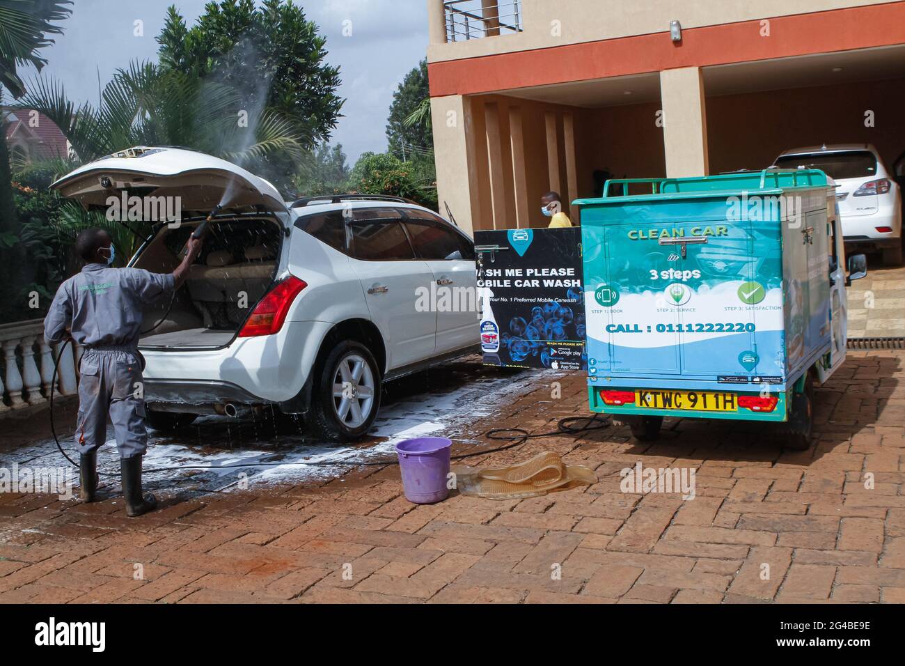 June 18, 2021, Nairobi, Kiambu County, Kenya A staff member of Wash Me