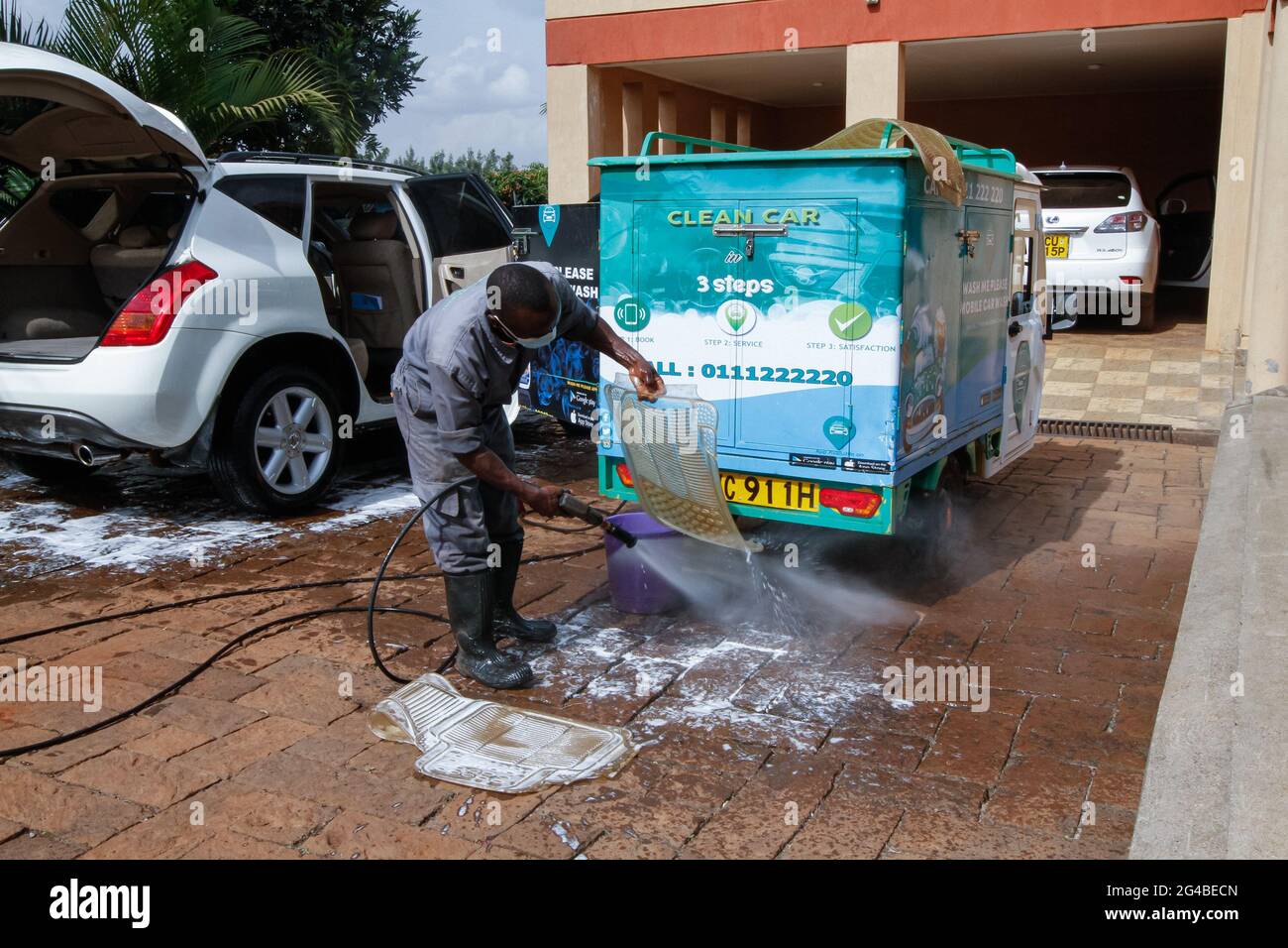 June 18, 2021, Nairobi, Kiambu County, Kenya A staff member of Wash Me