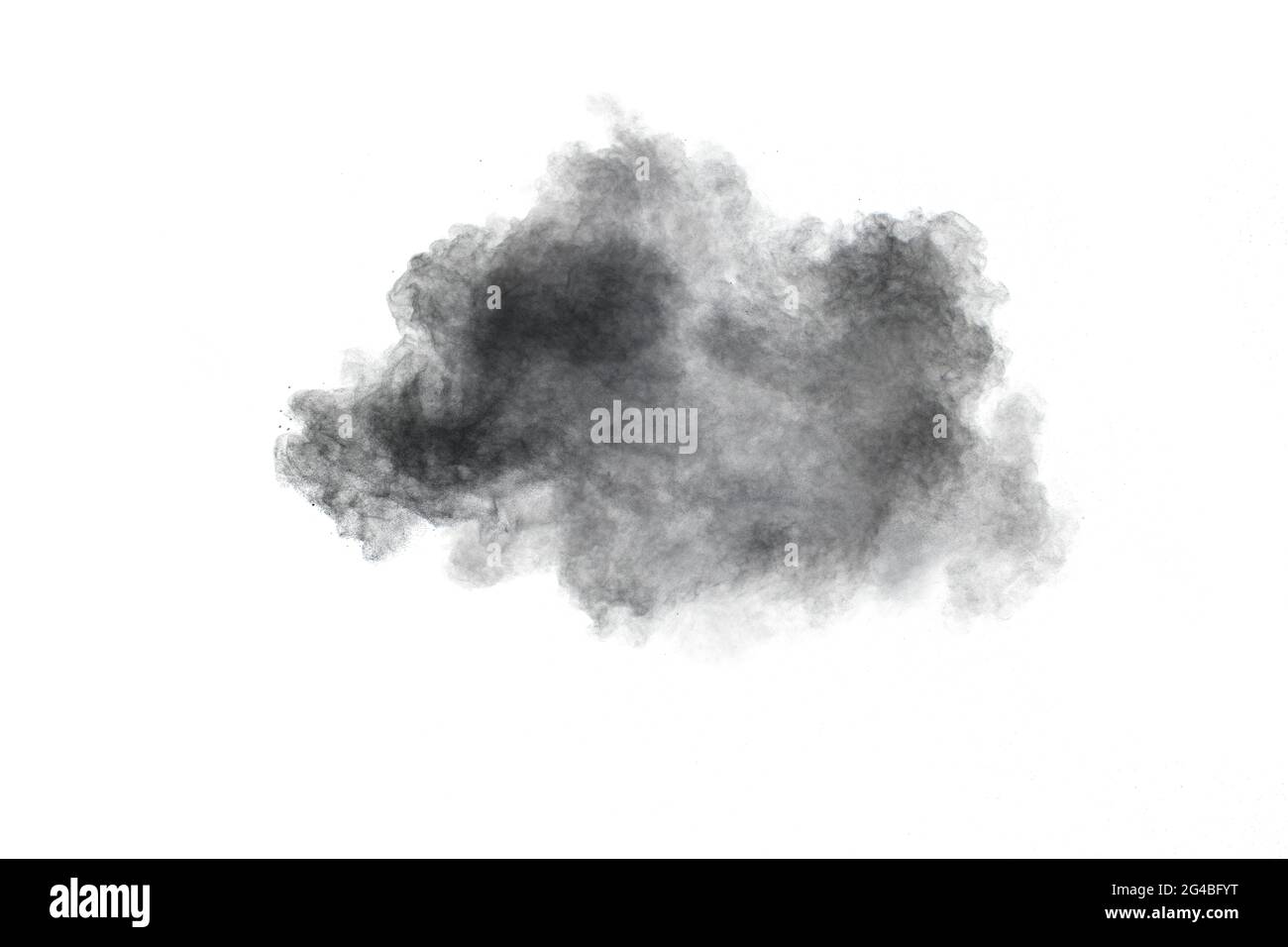 Black powder exploding.The particles of charcoal splash on white background. Stock Photo