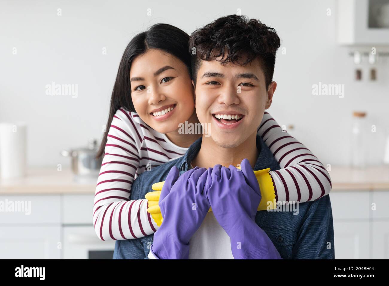 Portrait of beautiful asian couple house-keeping together, kitchen interior  Stock Photo - Alamy