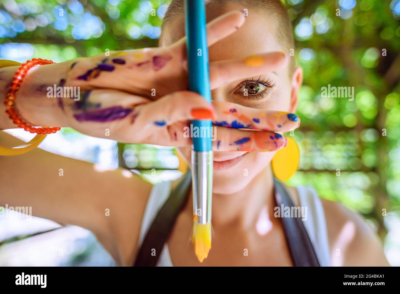 Woman artist covered in paint hi-res stock photography and images - Alamy