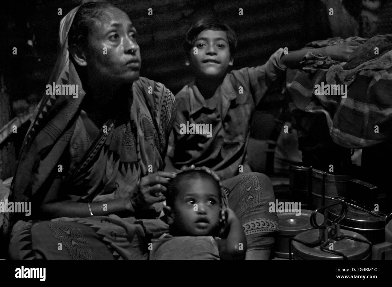 Rubel with his family: his mother and baby nephew at kathalbagan shanty. Dhaka, Bangladesh. May 2, 2007. Stock Photo