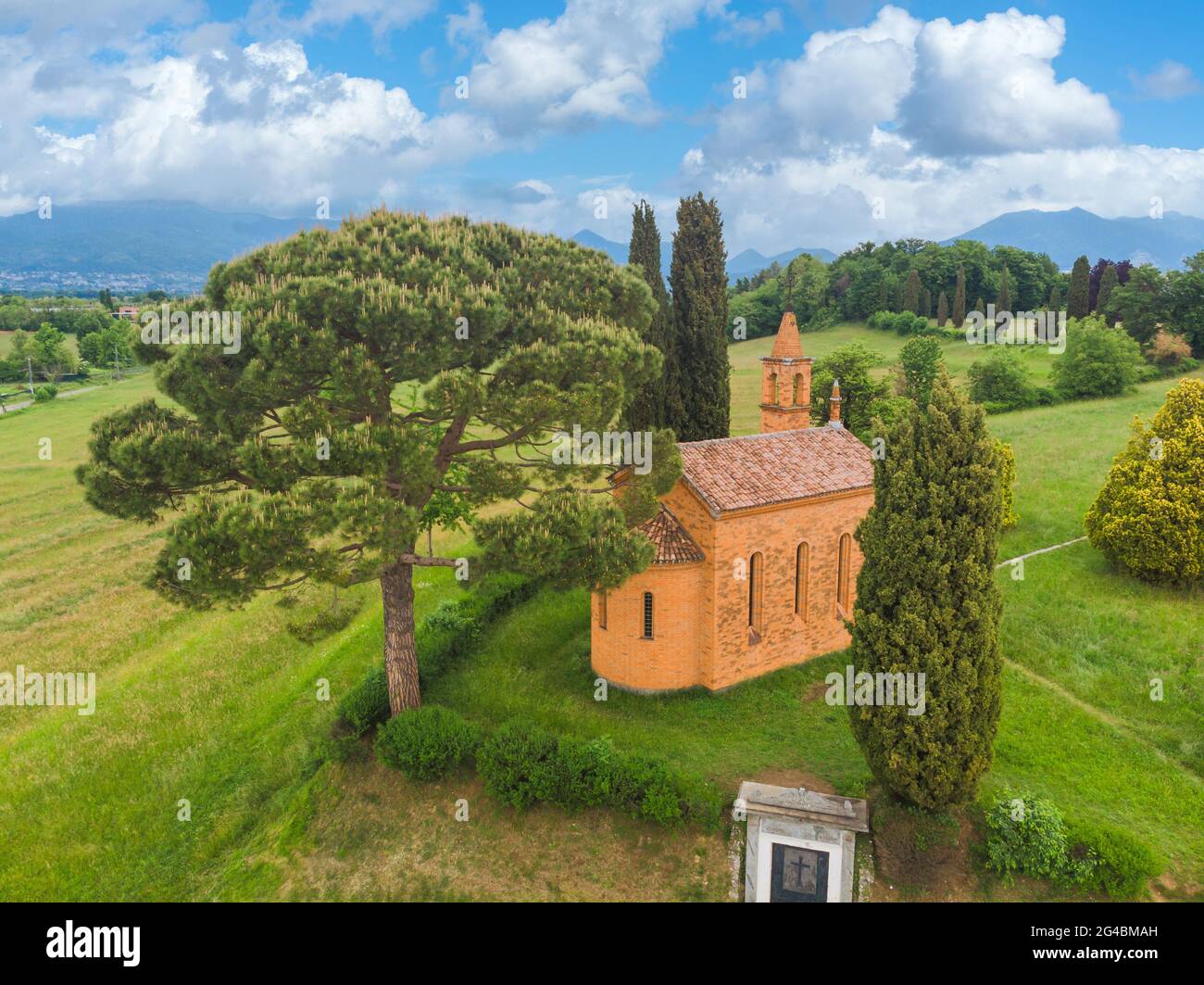 The red small church of Pomelasca aerial shot, Como, Italy Stock Photo