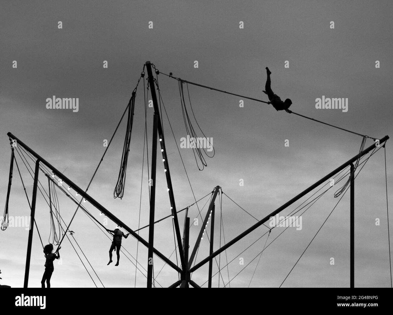 Jumping, playing and having fun in black and white photo scene Stock Photo