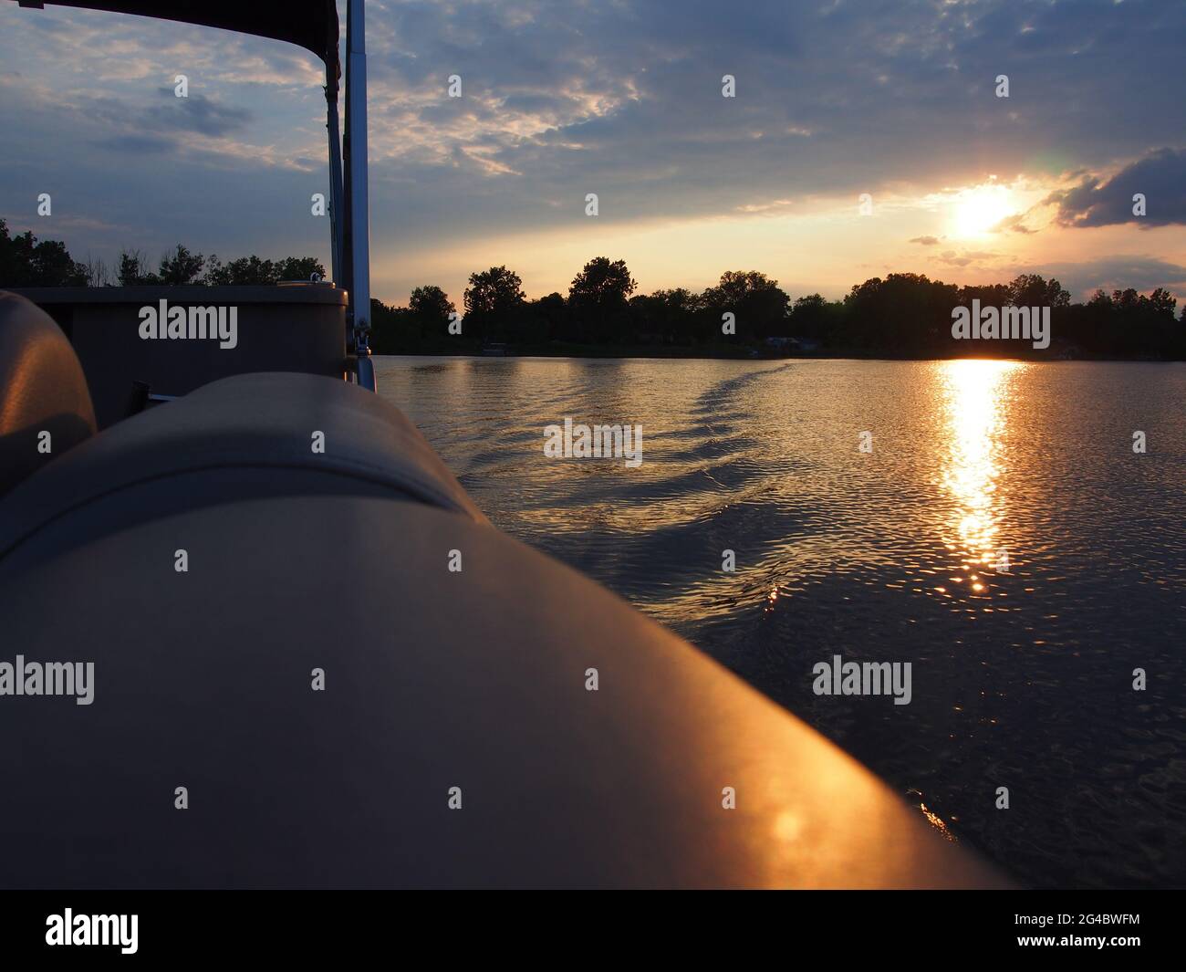 Lake Sunset Reflecting on Pontoon Boat on Lake Lansing in Haslett, Mi