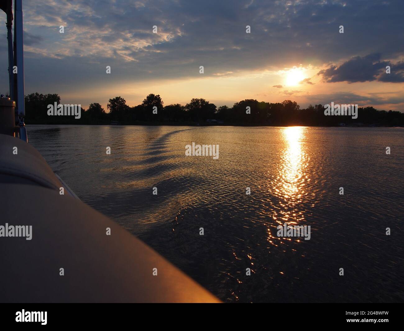 Lake Sunset Reflecting on Pontoon Boat on Lake Lansing in Haslett, Mi