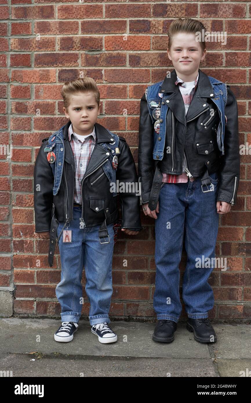 kids wearing Leather Jackets.mini rockers . Stock Photo