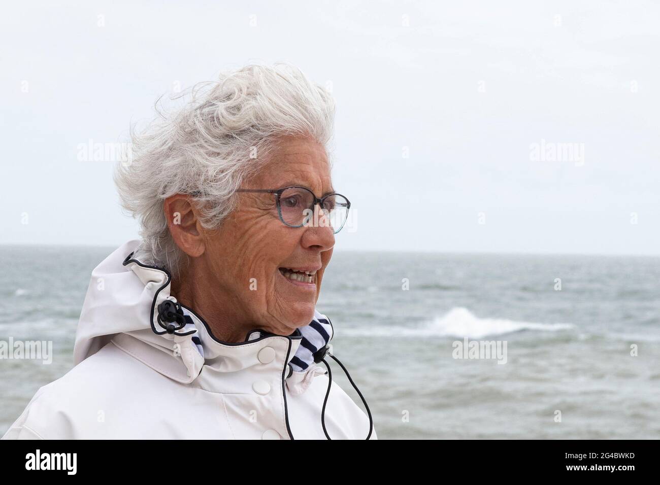 Happy smiling old woman walks hi-res stock photography and images - Alamy