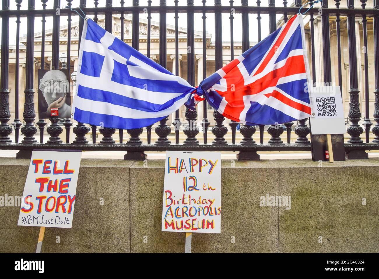 The UK and Greek flags as well as placards placed outside the British  Museum during the protest.The British Committee for the Reunification of  the Parthenon Marbles held a demonstration outside the British