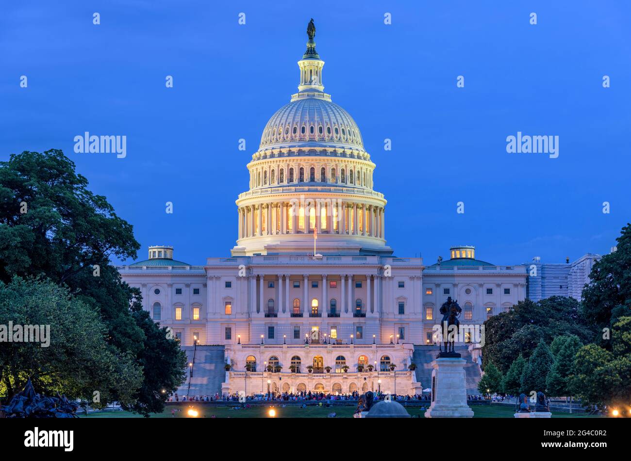 Summer Night at Capitol Hill - A dusk view of west-side of the U.S. Capitol Building, as a summer concert at front, Washington, D.C., USA. Stock Photo