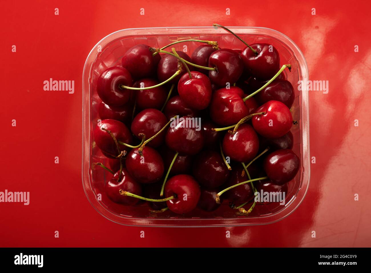 supermarket packaging with cherries Stock Photo