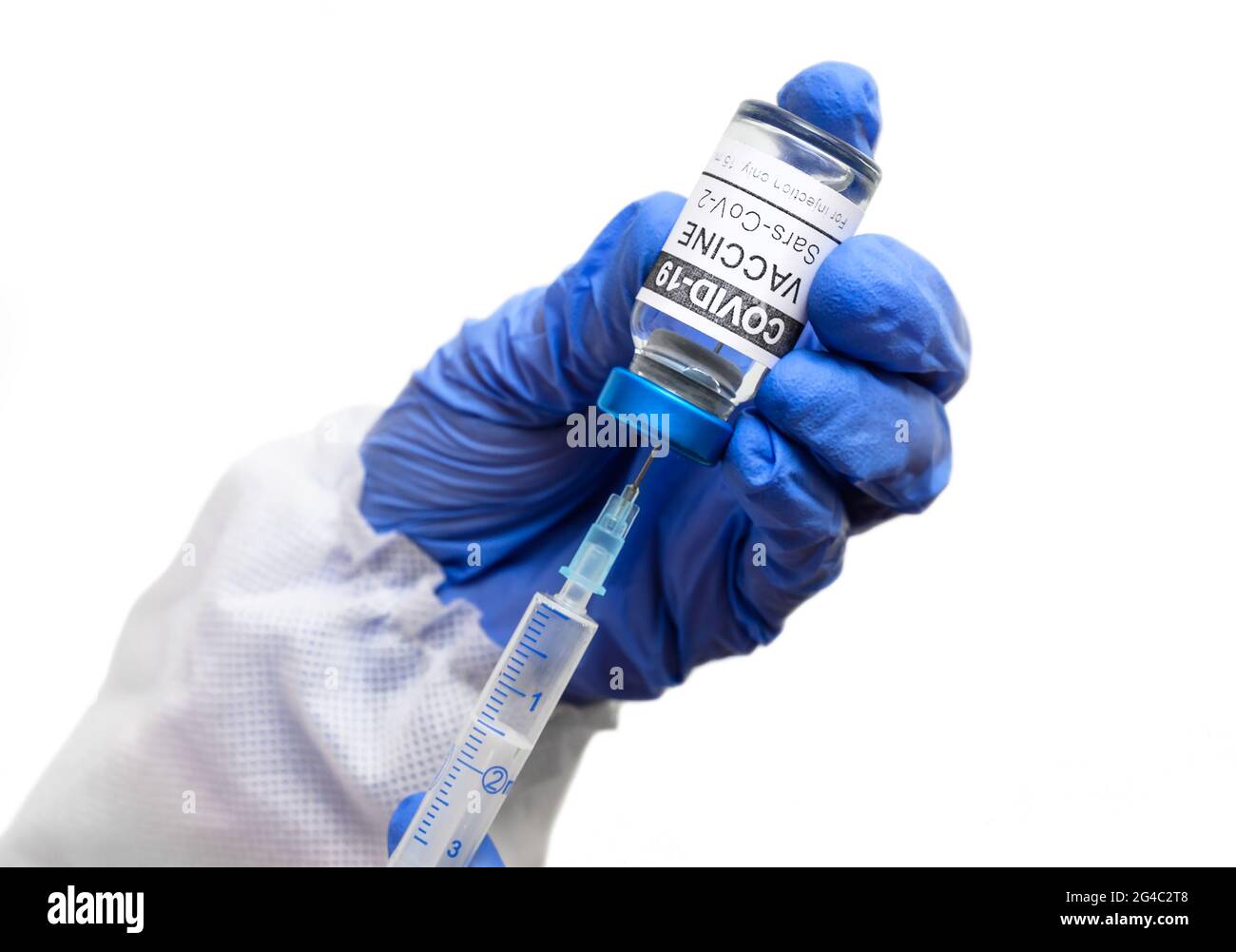 COVID-19 vaccine in doctor hands isolated on white background, nurse holds syringe and coronavirus vaccine vial. Concept of vaccination, immunization, Stock Photo