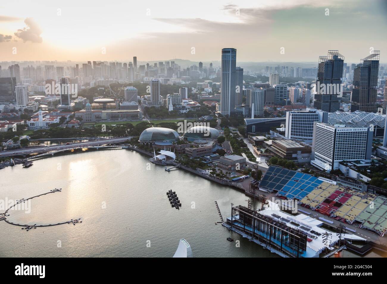 View of downtown Singapore and Marina Bay at the electric hour as the sun begins to set Stock Photo