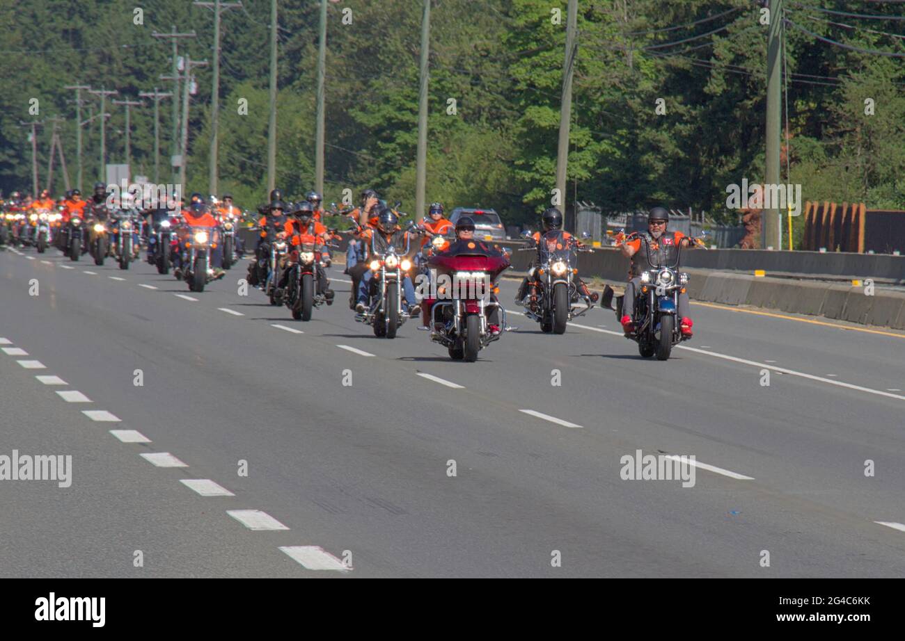 Over 100 take part in a 06/20/2021 motorcycle memorial ride on Vancouver Island for 215 Indigenous children found in unmarked graves in BC, Can. Stock Photo