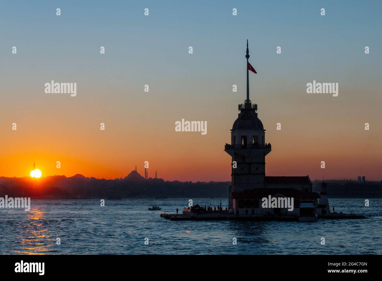 Maiden's Tower in silhouette at the sunset, which was a Byzantine lighthouse on the Bosphorus, Istanbul, Turkey Stock Photo