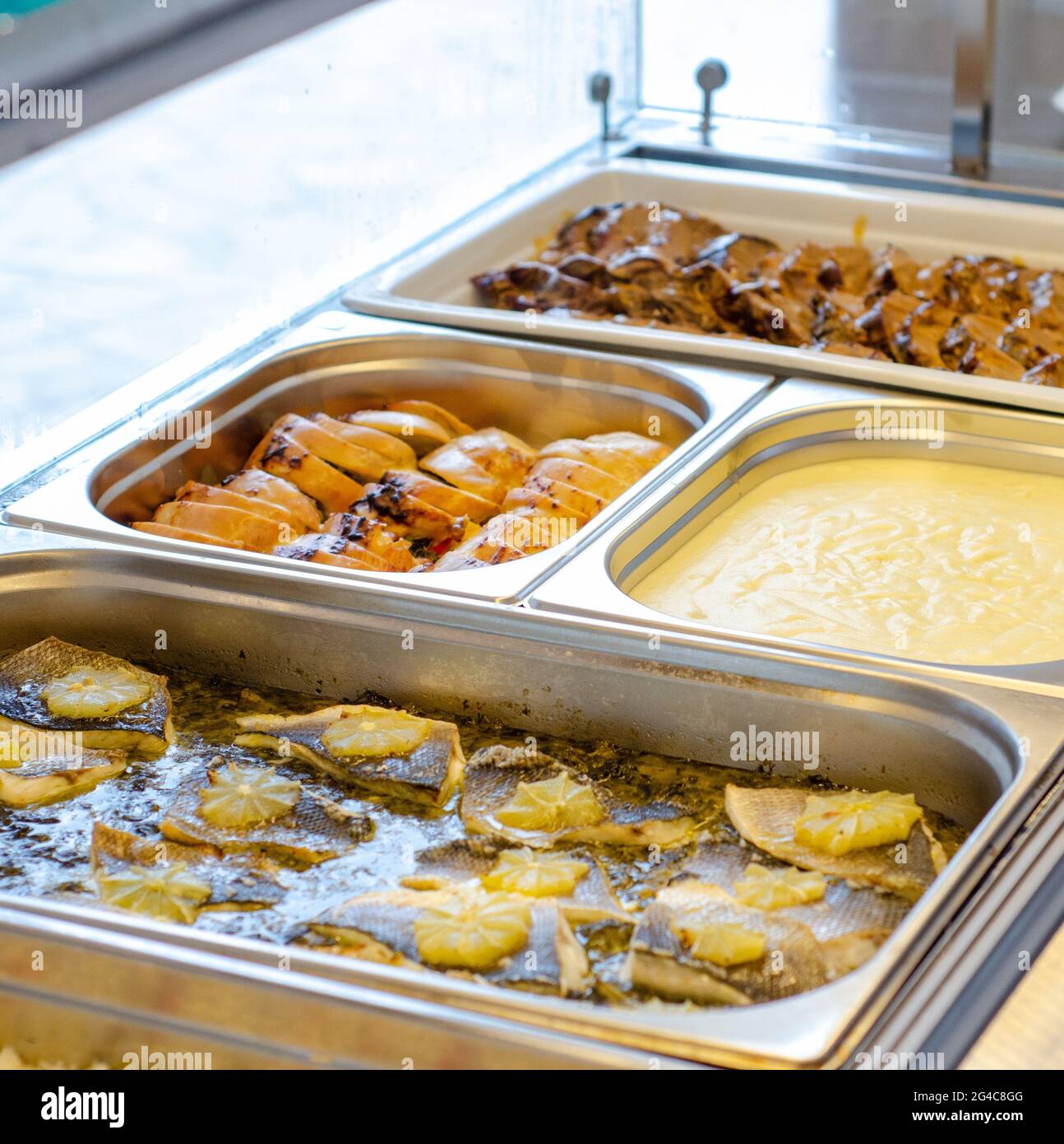 A soft focus of various dishes in a food display counter at a buffet