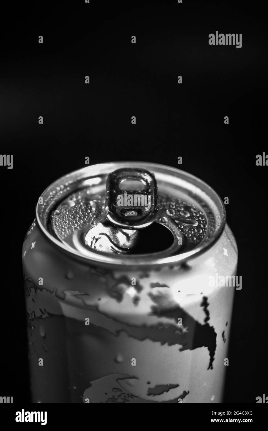 hand opens an aluminum can in gray Stock Photo