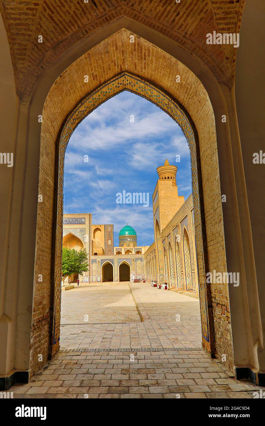Poi Kalon Mosque and Minaret through archway in Bukhara, Uzbekistan Stock Photo
