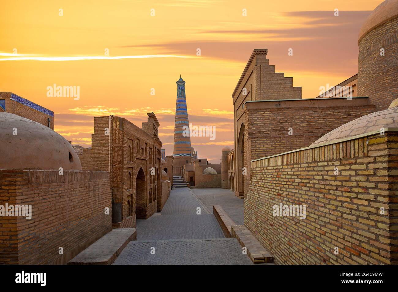 Old town Khiva at the sunrise with Islam Khoja Minaret in the background, Uzbekistan Stock Photo