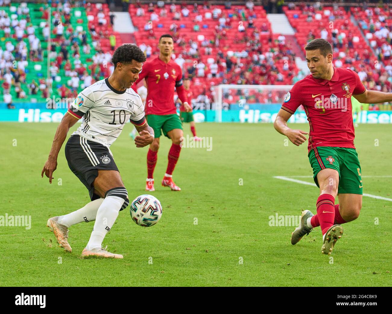 Munich, Germany. 19th June, 2021. Munich, Germany. 19th June, 2021. Serge Gnabry, DFB 10 compete for the ball, tackling, duel, header, zweikampf, action, fight against Raphael GUERREIRO, Por 5 in the Group F match PORTUGAL - GERMANY 2-4 at the football UEFA European Championships 2020 in Season 2020/2021 on June 19, 2021 in Munich, Germany. Credit: Peter Schatz/Alamy Live News Stock Photo
