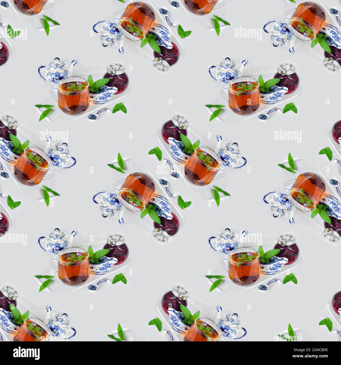 A cup of mint tea, fresh honeysuckle berries with jam on the kitchen countertop. Seamless textile pattern Stock Photo