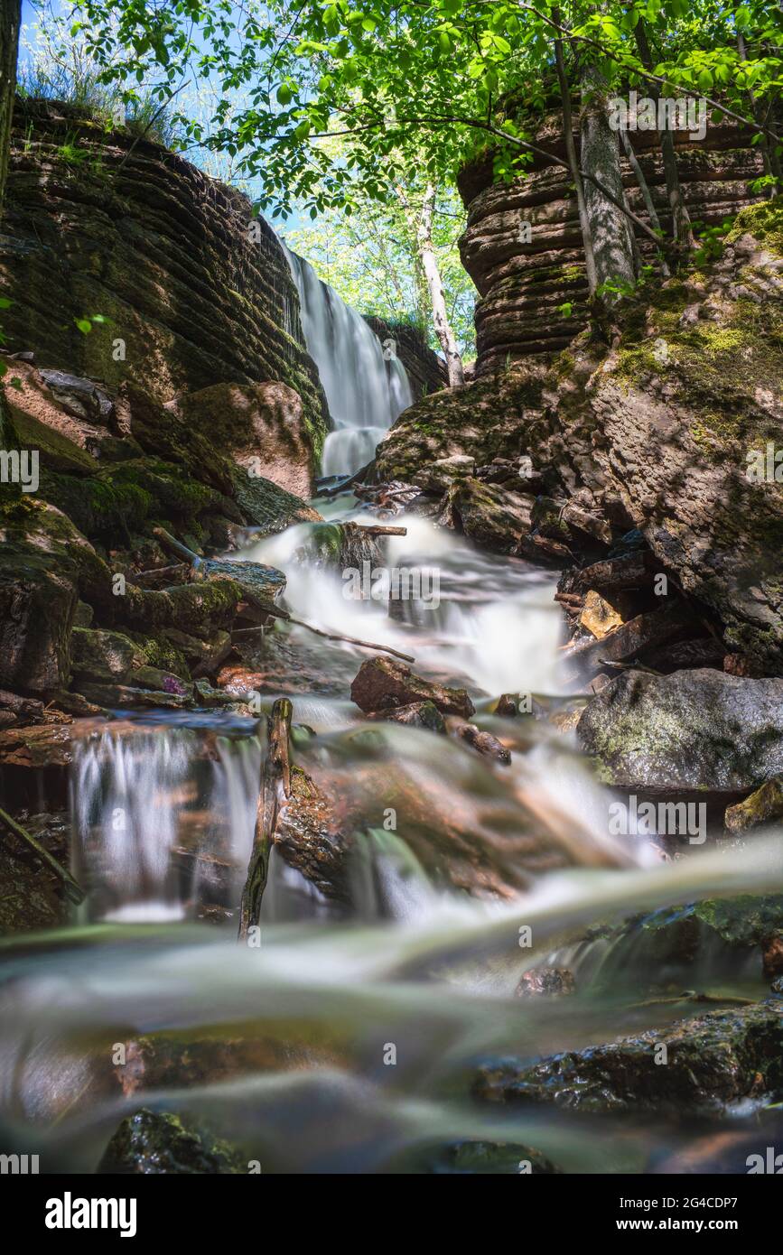 Martorpsfallet Waterfall, Creek decending in forest on limestone rock Stock Photo