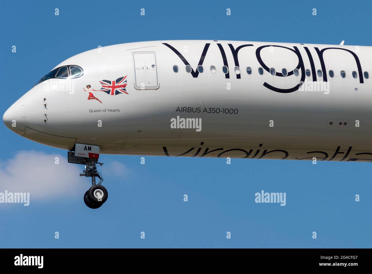 Virgin Atlantic Airbus A350 airliner jet plane G-VJAM named Queen of Hearts coming in on finals to land at London Heathrow Airport, UK. Nose art Stock Photo