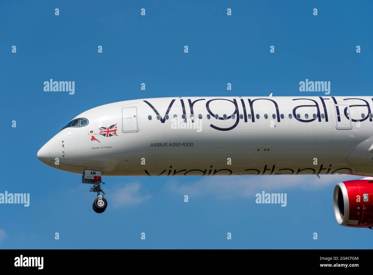 Virgin Atlantic Airbus A350 airliner jet plane G-VJAM named Queen of Hearts coming in on finals to land at London Heathrow Airport, UK. Nose art Stock Photo