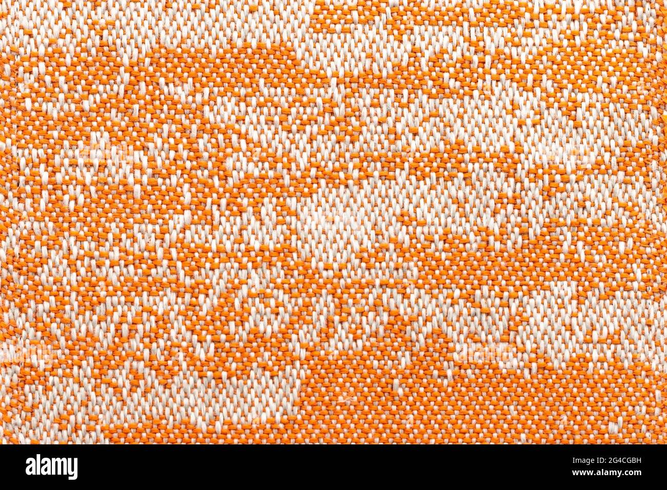 Orange fabric with marbled design. Textile texture background. Abstract backdrop. Stock Photo