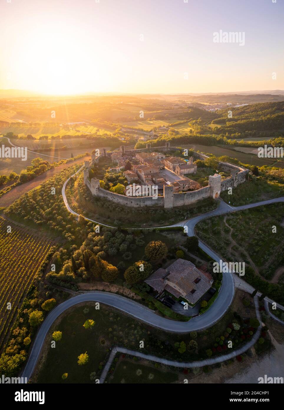Aerial view of the medieval town of Monteriggioni at sunset. Monteriggioni, Siena district, Tuscany, Italy. Stock Photo