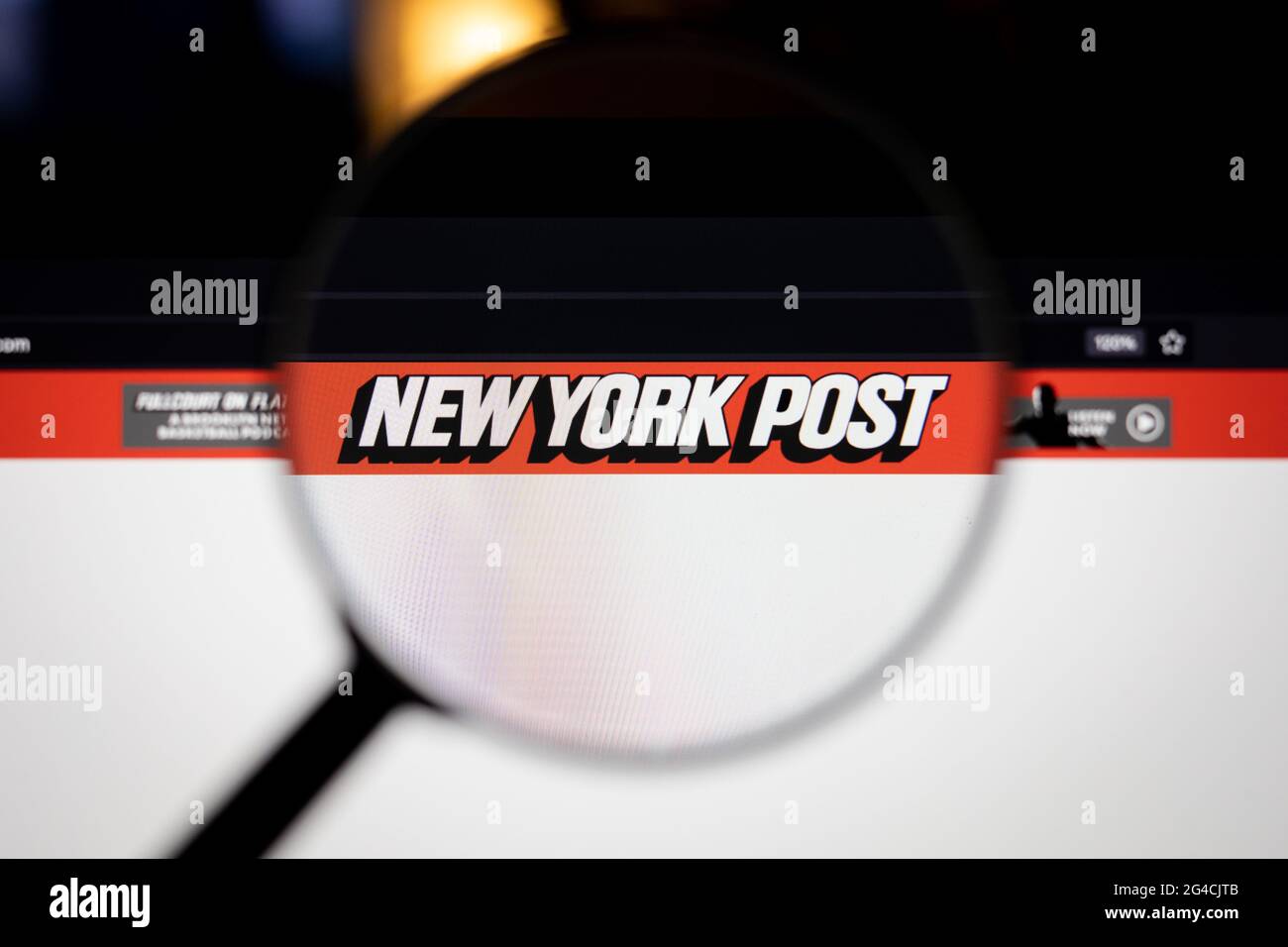 New York Post company logo on a website, seen on a computer screen through a magnifying glass.new york post, news, logo, company, website, business, h Stock Photo