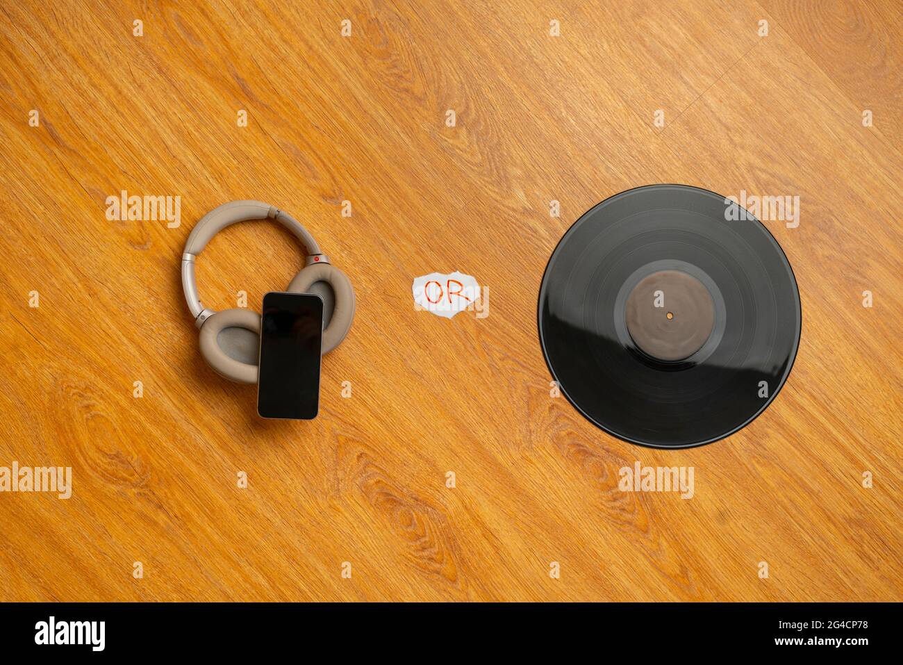 analog versus digital music, headphones and vinyl cassette flat lay