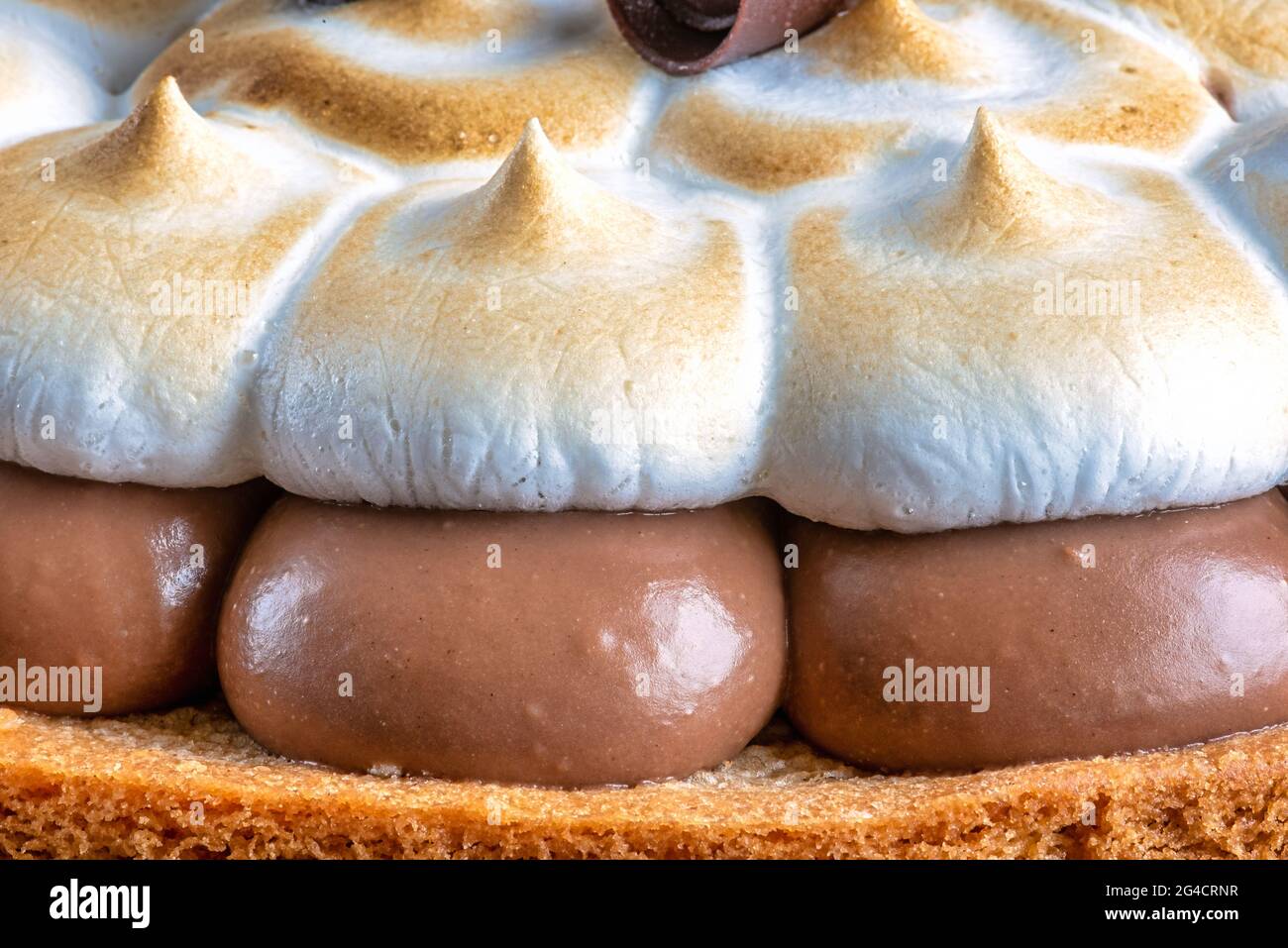 Chocolate meringue cake, close-up detail of sweet food Stock Photo