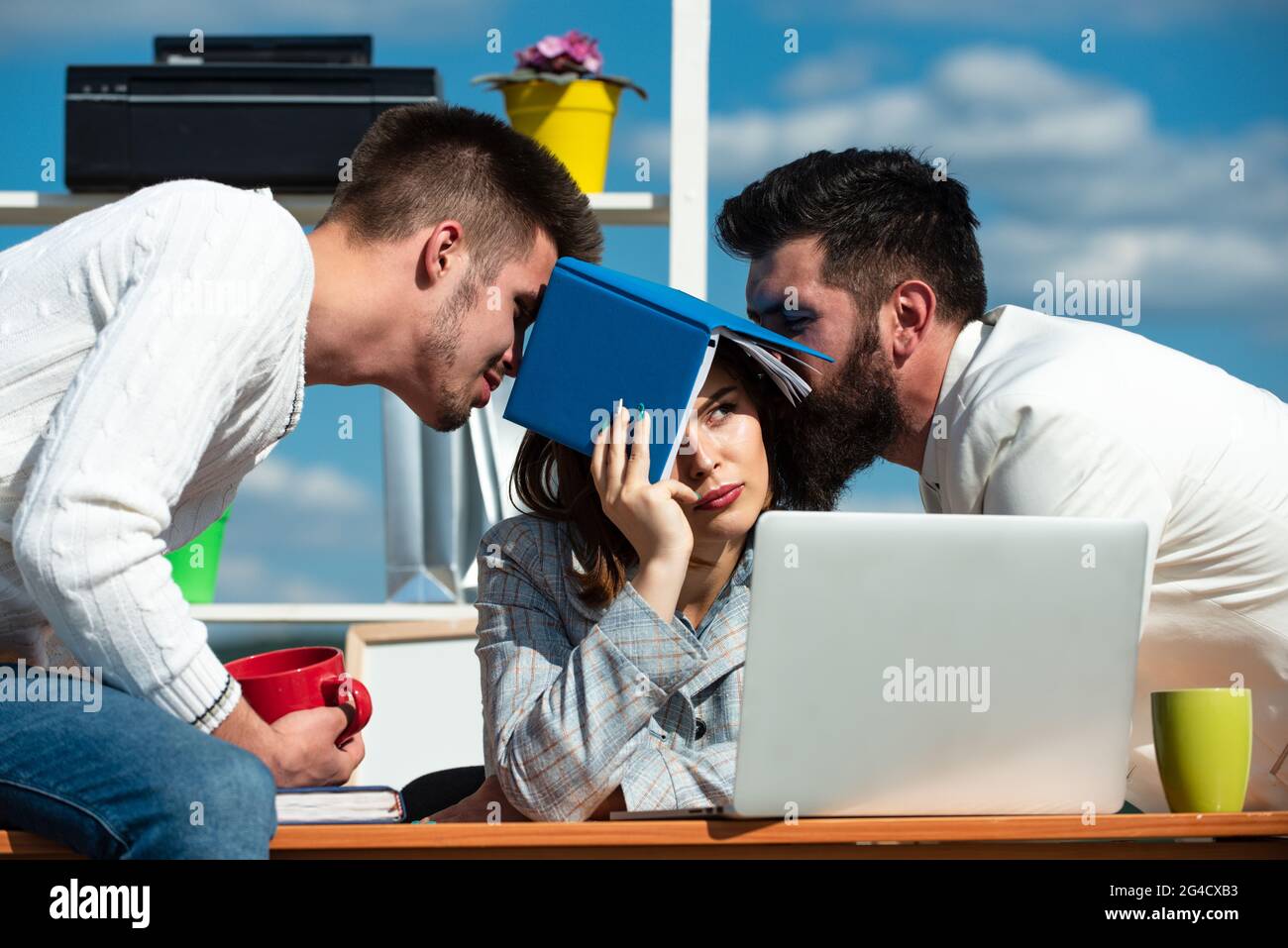 Office workers talking. Sad secretary, assistant and manager. Business team discuss at the outdoor. Boring meeting. Stock Photo