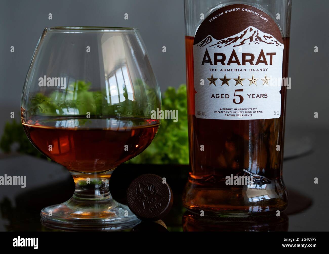 Kiev, Ukraine. 19th June, 2021. In this photo illustration, a bottle of the famous Armenian cognac Ararat, aged 5years next to a glass of Ararat. (Photo by Valera Golovniov/SOPA Images/Sipa USA) Credit: Sipa USA/Alamy Live News Stock Photo