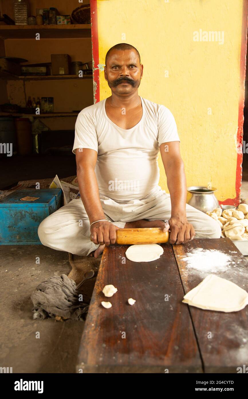 https://c8.alamy.com/comp/2G4CYTD/attractive-indian-street-seller-man-with-big-mustache-making-rolls-dough-balls-samosa-for-his-soap-2G4CYTD.jpg
