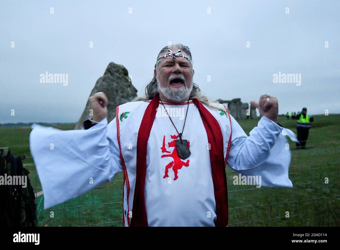 Arch-Druid Arthur Pendragon speaks in front of Stonehenge ancient stone circle, during the celebrations of the Summer Solstice, despite official events being cancelled amid the spread of the coronavirus disease (COVID-19), near Amesbury, Britain, June 21, 2021. REUTERS/Toby Melville Stock Photo