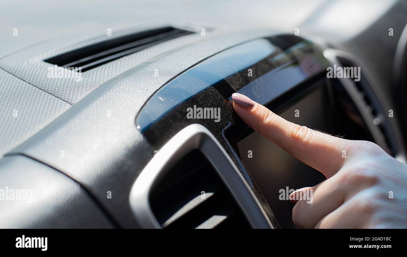 Wipe dust off car dashboard with finger Stock Photo Alamy