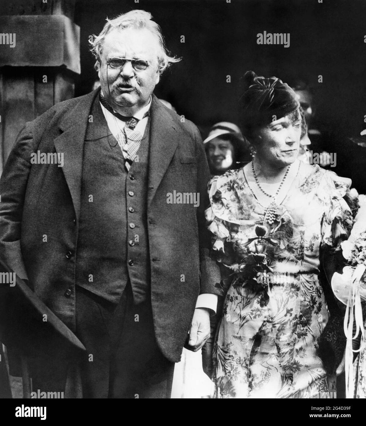 G.K. Chesterton and his brother Cecil's wife, Ada, after the wedding ceremony of Ada's secretary, Miss E. Gordon Dunham, to G.H.N. Phillipps in London, England, September 4, 1933. Stock Photo