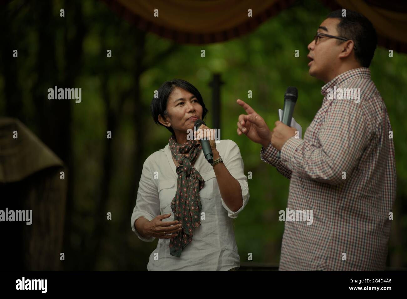 Indonesian broadcast news presenter Desi Anwar and Muhammad Farhan having a talk show on national park and nature conservation on stage, during an event held by Indonesia's Ministry of Forestry in Way Kambas National Park, Lampung, Indonesia. Stock Photo