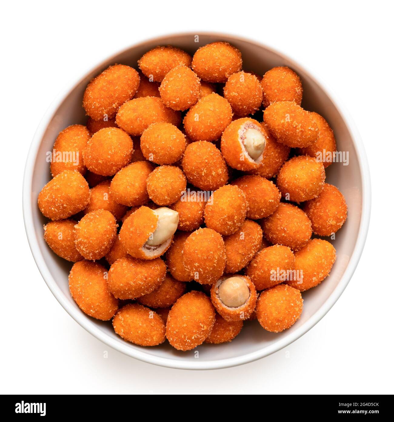 Paprika coated peanuts in a white ceramic bowl isolated on white. Whole