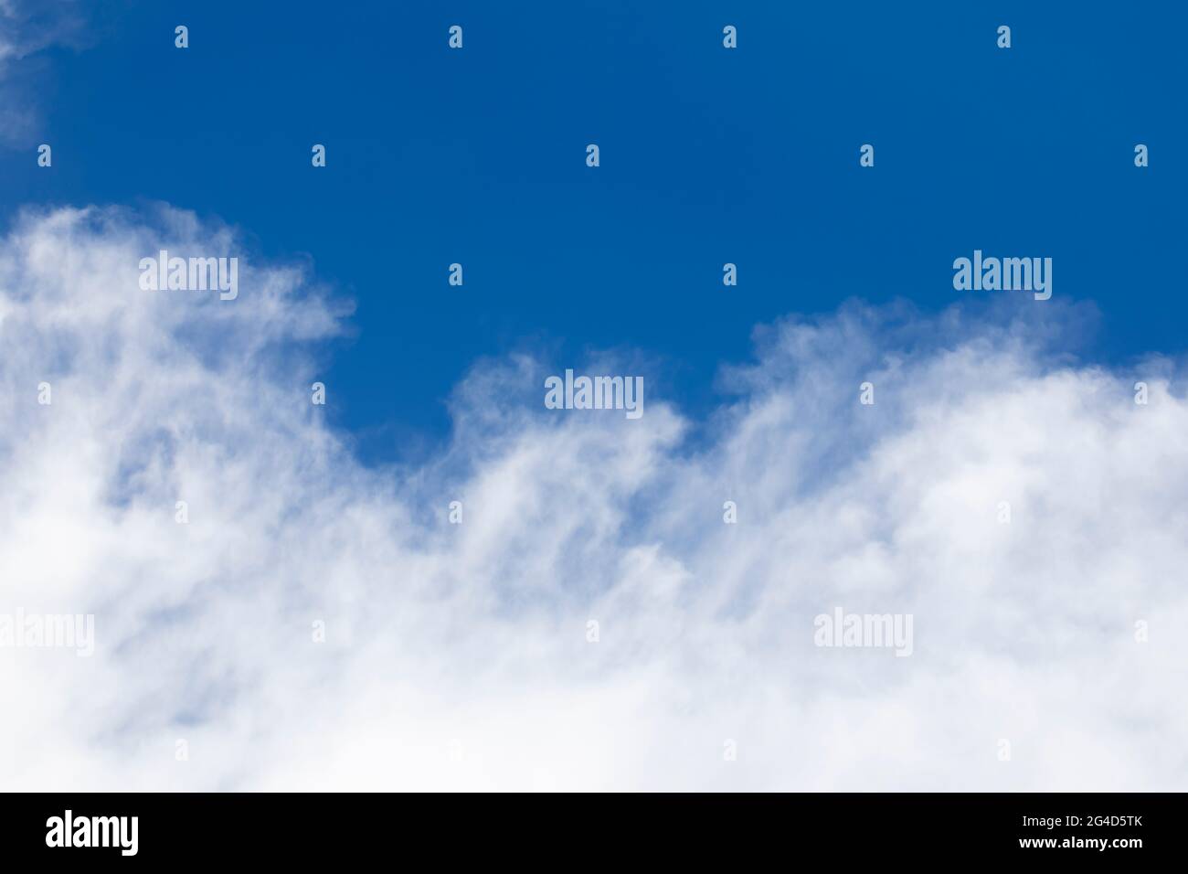 Blue sky background and white clouds soft focus, and copy space horizontal shape. Stock Photo