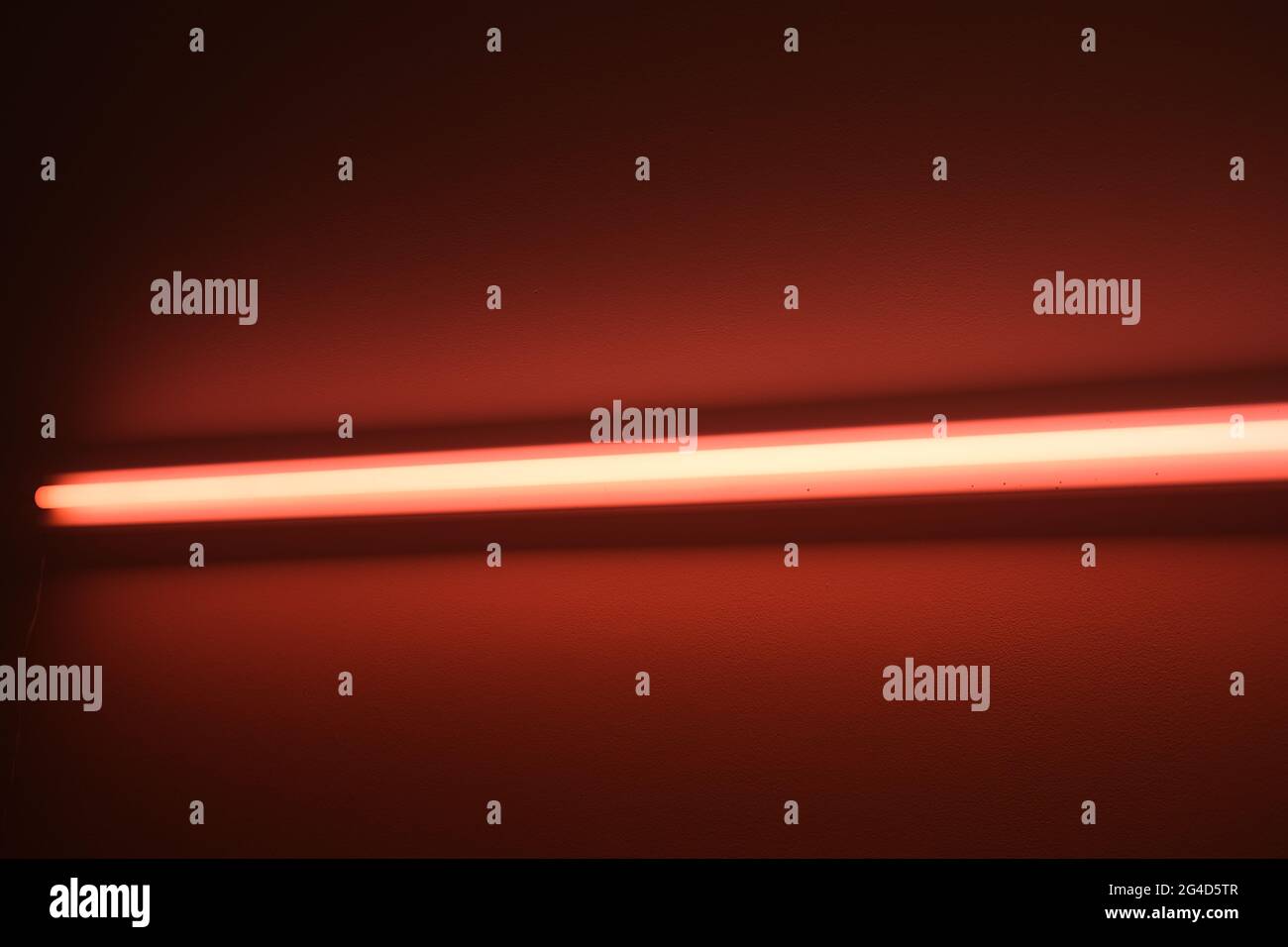 Red LED light bar on a wall Stock Photo Alamy