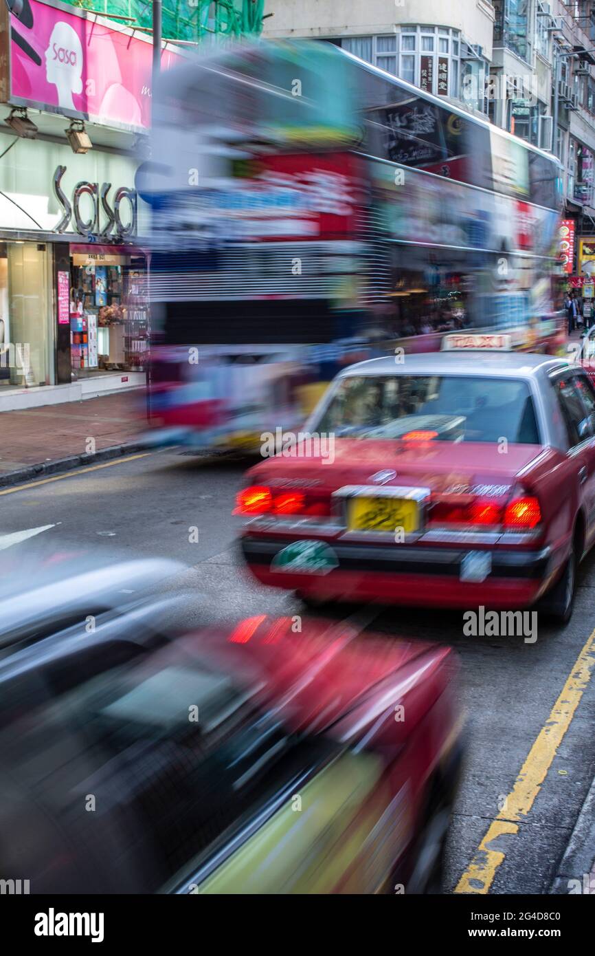 Motion blurred Taxis in Hong Kong.Motion blured traffic Stock Photo